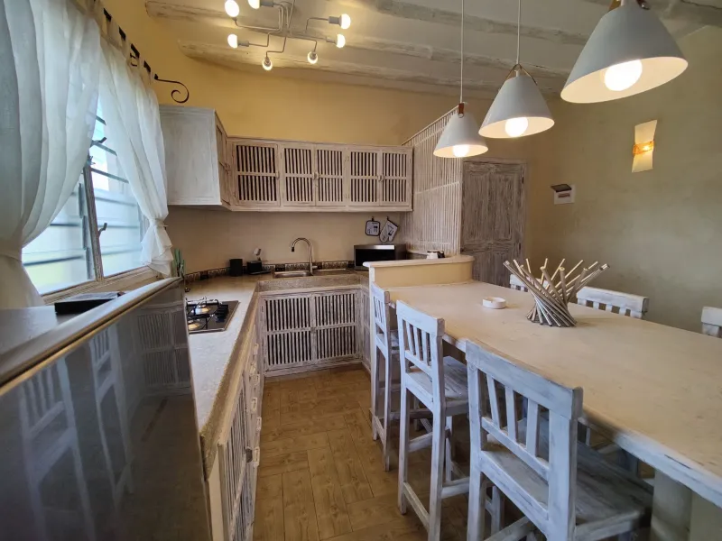The villa dining table and kitchen